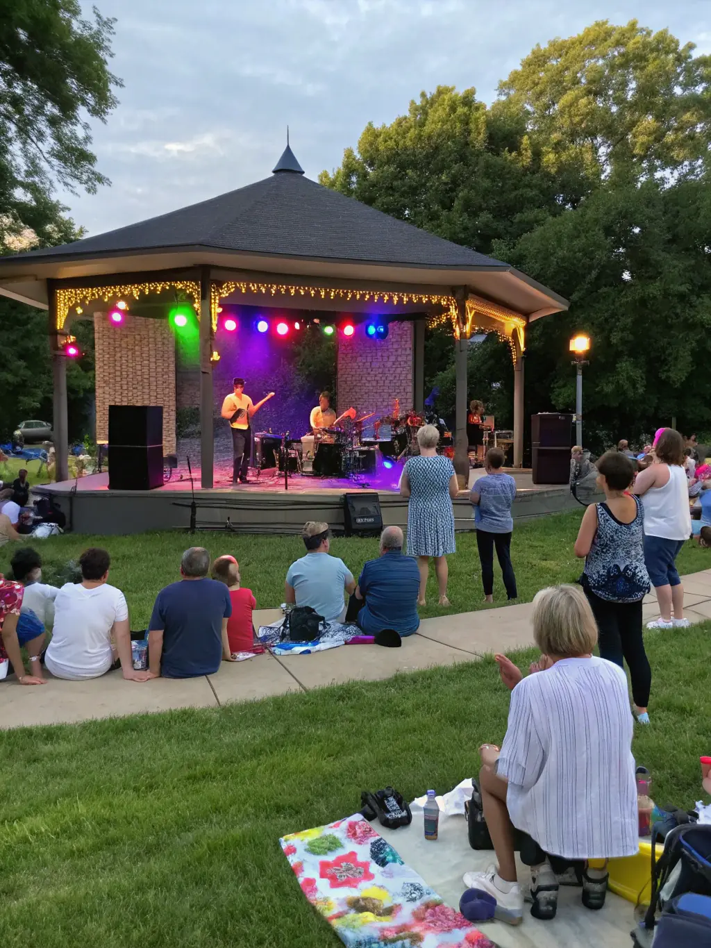 A vibrant photograph capturing a live musical performance at one of HASTONMUSIC PRODUCTION's community concerts, showcasing diverse musicians and an engaged audience.